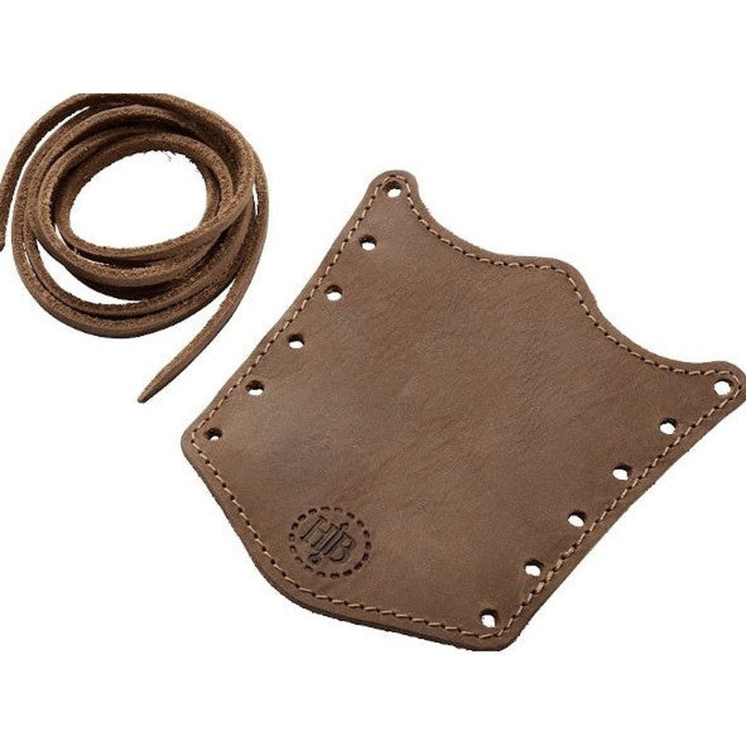 A brown Hults Bruk Overstrike Guard with a coiled leather strap lies on a white background.