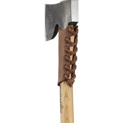 A close-up of the Hults Bruk Overstrike Guard axe sheath with brown leather lacing and a wooden handle against a white background.