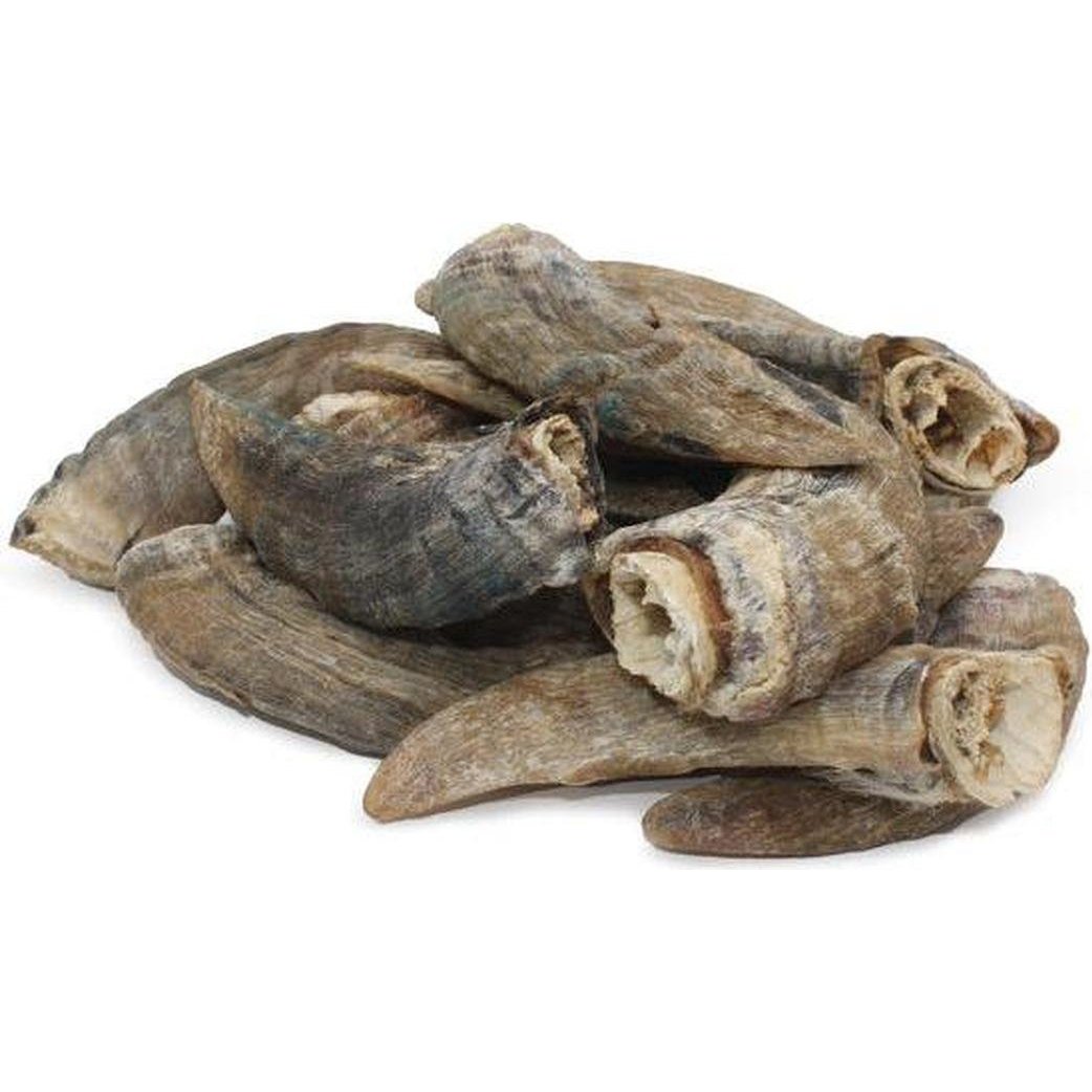 A pile of Icelandic+ Small Lamb Horn with Marrow treats on a white background.