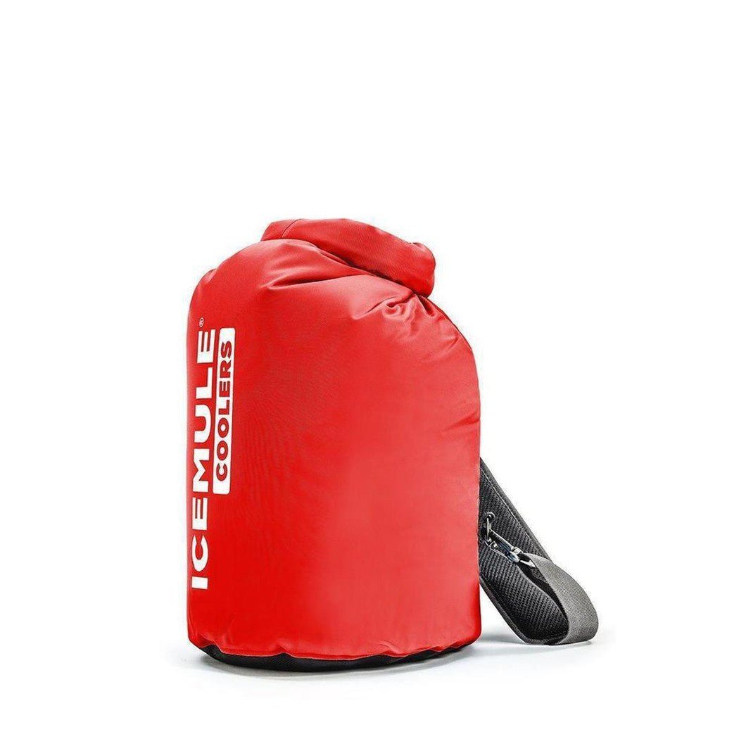 Side view of the IceMule Coolers Classic Cooler Large 20L in Crimson Red with a black shoulder strap against a white background.