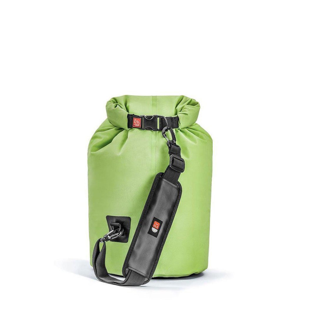 Side view of the IceMule Coolers Classic Cooler Large 20L in Crimson Red showing the roll-top closure and shoulder strap against a white background.