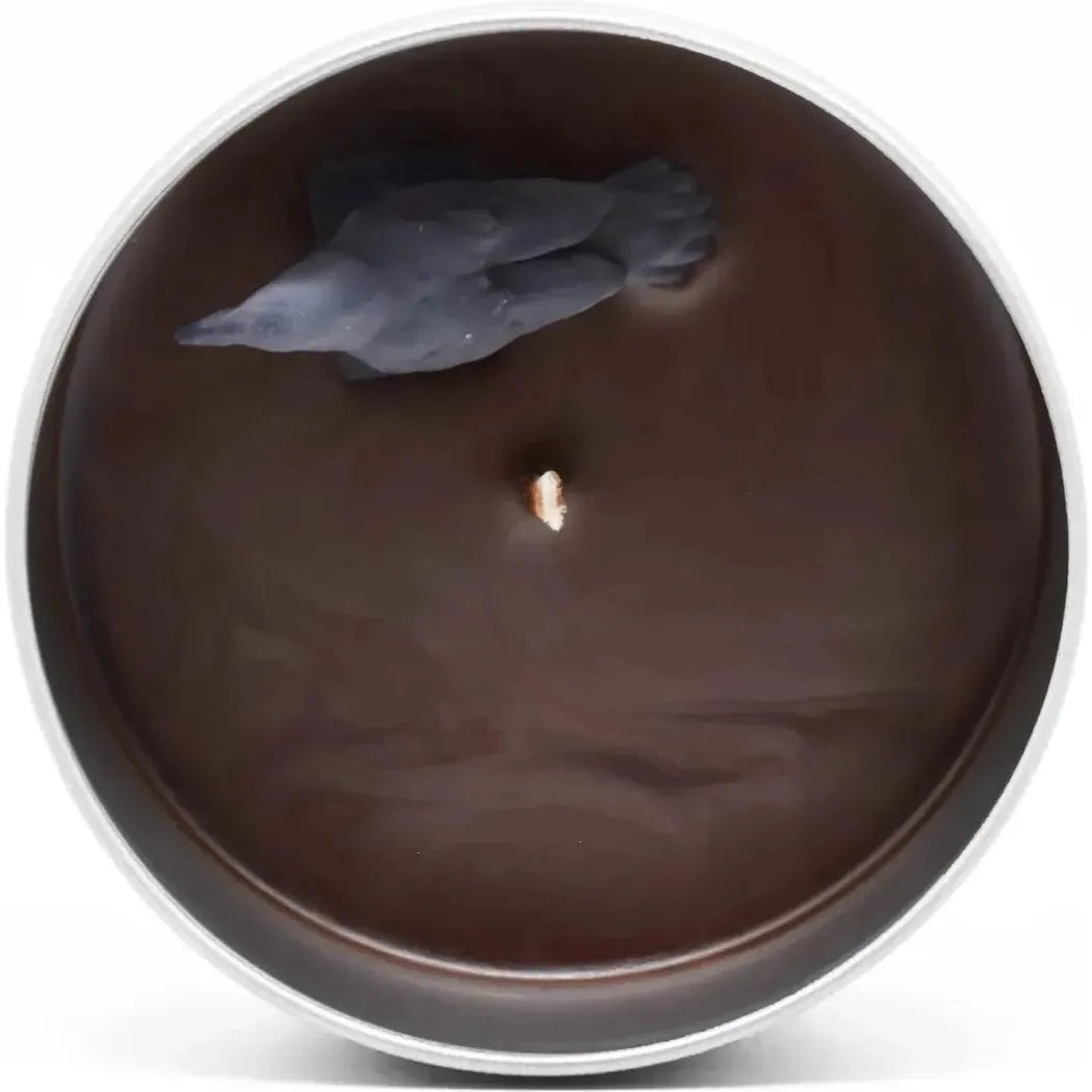 Top-down view of the JD and Kate Industries Edgar Allan Poe Scented Candle with a dark wax surface and a small wick in the center.
