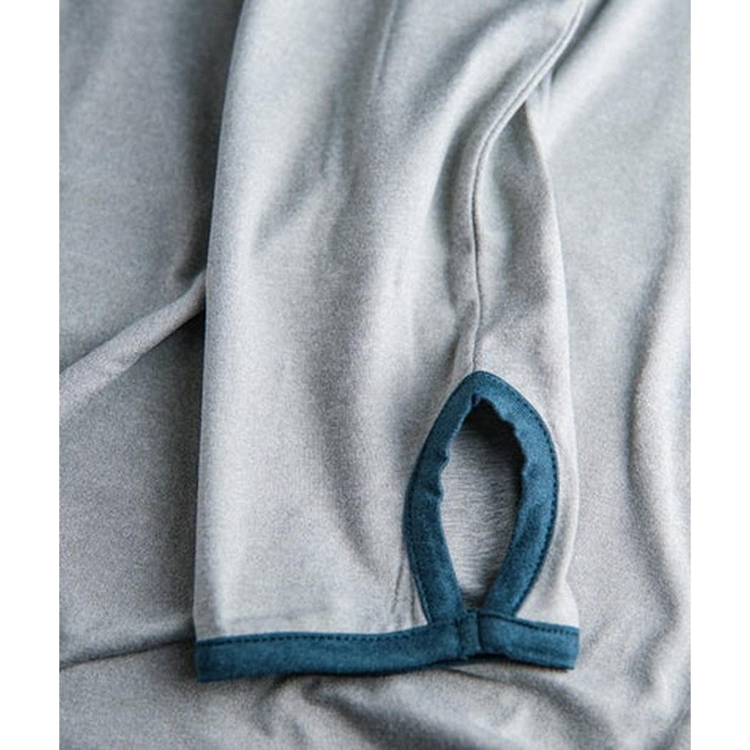 A close-up of the Jetty Men's Mahi UV Tech Hoodie in Grey showing the grey fabric and blue trim on the sleeve cuff.