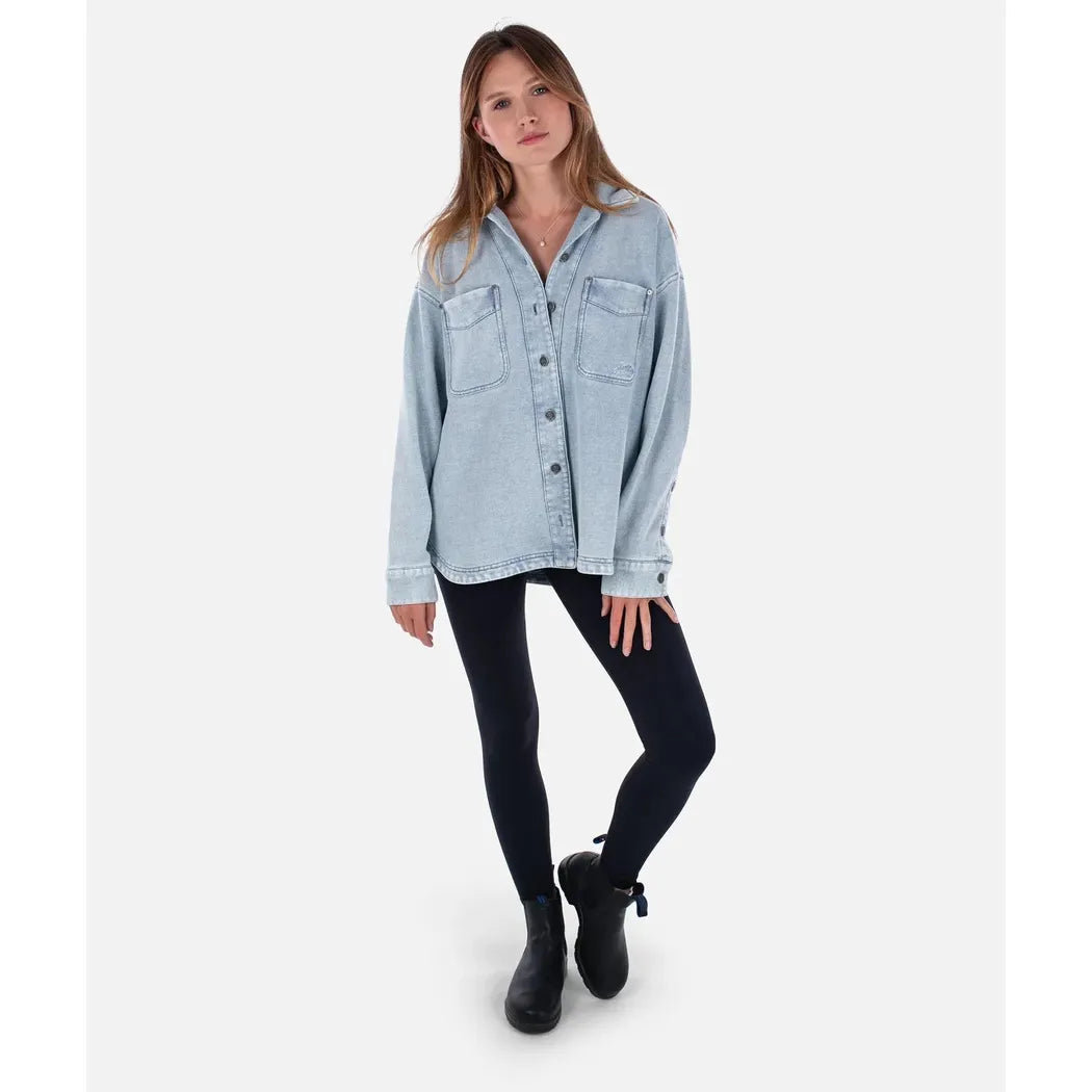 A model wearing the Jetty Women's Eden Knit Shirt in Denim stands against a plain white background.