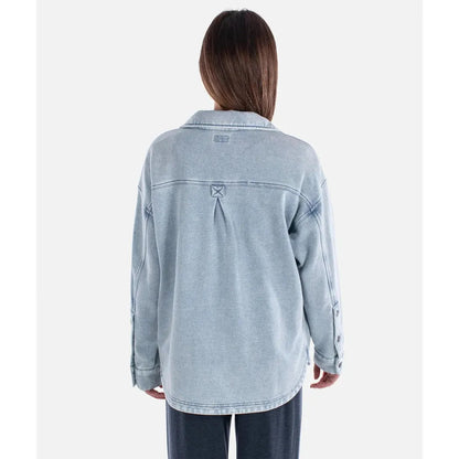 Back view of the Jetty Women's Eden Knit Shirt in Denim on a model against a plain white background.