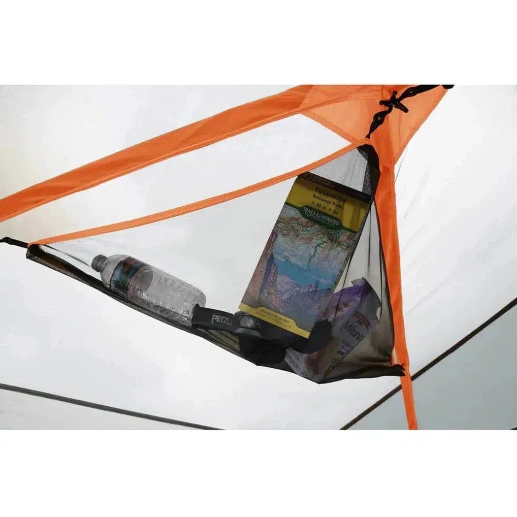 A close-up of the Johnson Outdoors Eureka! Copper Canyon LX 6 tent interior showing a water bottle and map inside.
