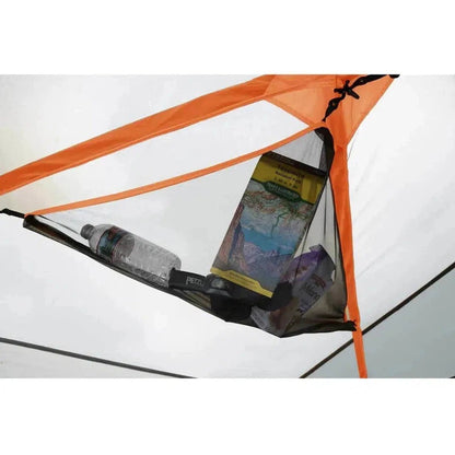 A close-up of the Johnson Outdoors Eureka! Copper Canyon LX 6 tent interior showing a water bottle and map inside.