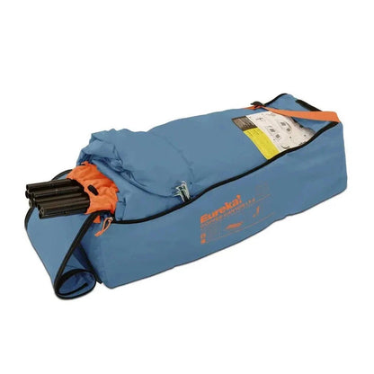 A blue Johnson Outdoors Eureka! Copper Canyon LX 6 tent bag with orange accents and a zipper, shown from a side angle against a white background.