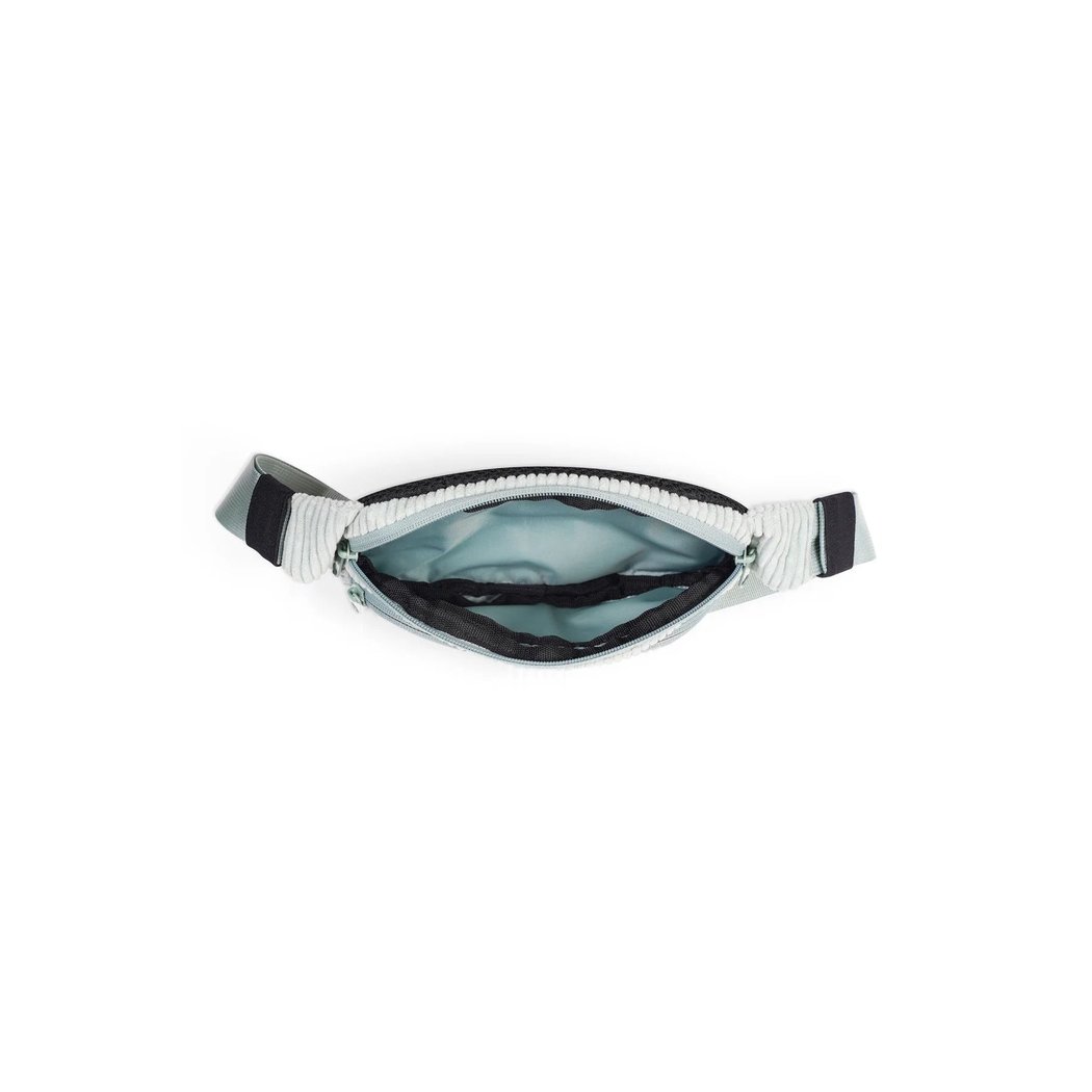 A top-down view of the Kavu Cord Spectator in Chocolate showing the zippered main compartment and adjustable strap against a white background.