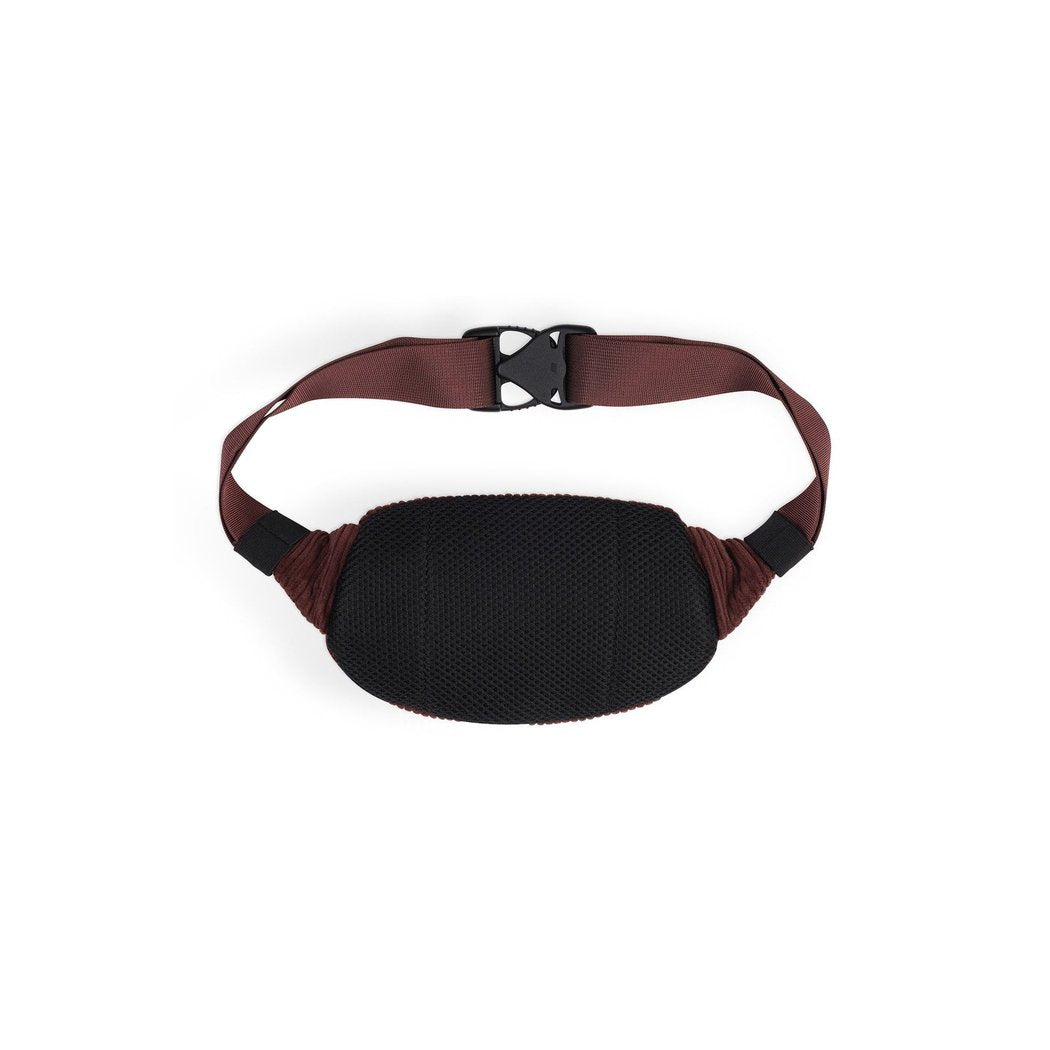 A top-down view of the Kavu Cord Spectator in Chocolate with a black mesh front and brown strap against a white background.