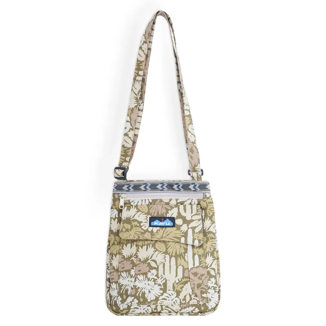 A front view of the Kavu Keeper bag in Cactus Garden with a floral pattern and adjustable strap against a white background.