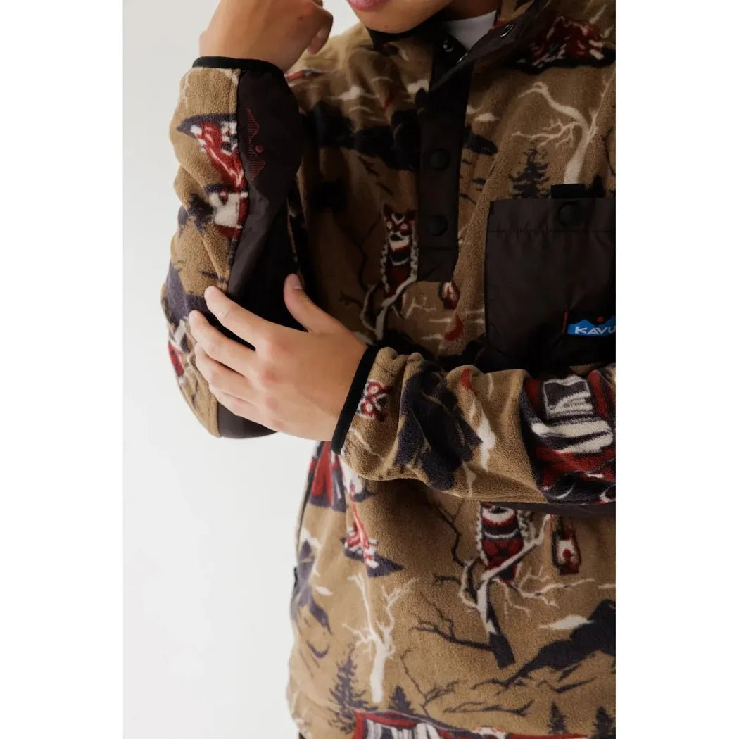 A close-up of the Kavu Men's Teannaway in Highland Camp showing the model's hand on the sleeve and a white background.