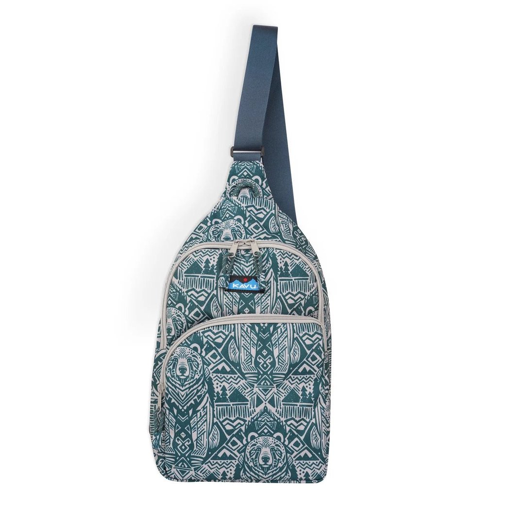 Side view of the Kavu Pender Pack in Frosty Foliage showing the zippered pockets and tribal pattern against a white background.