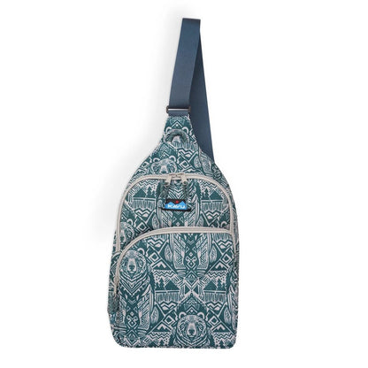 Side view of the Kavu Pender Pack in Frosty Foliage showing the zippered pockets and tribal pattern against a white background.