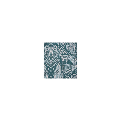A close-up of the Kavu Pender Pack in Frosty Foliage showing the bear graphic and geometric patterns.