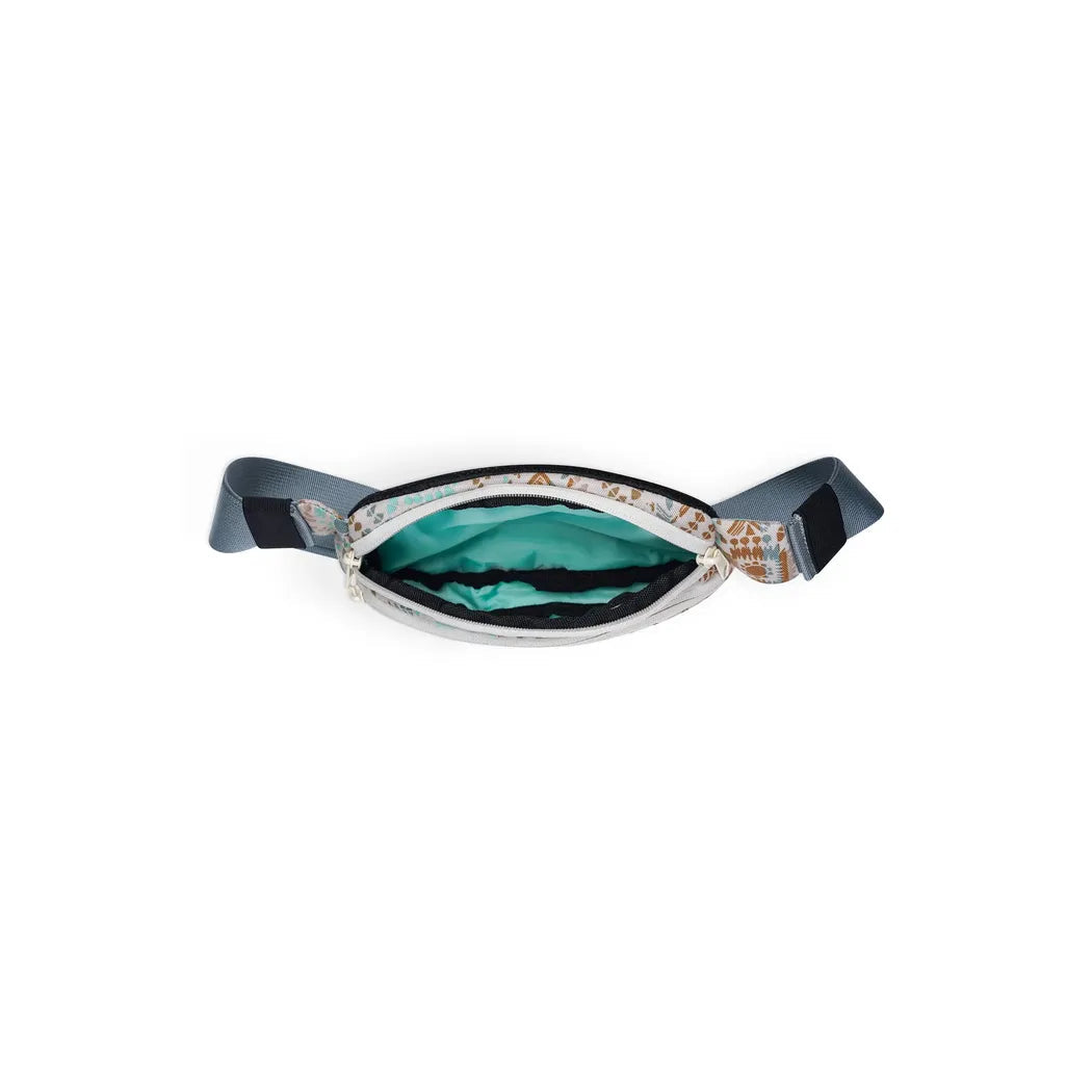 The Kavu Spectator Valley Trail waist pack is shown from above with its teal interior and charcoal straps against a white background.