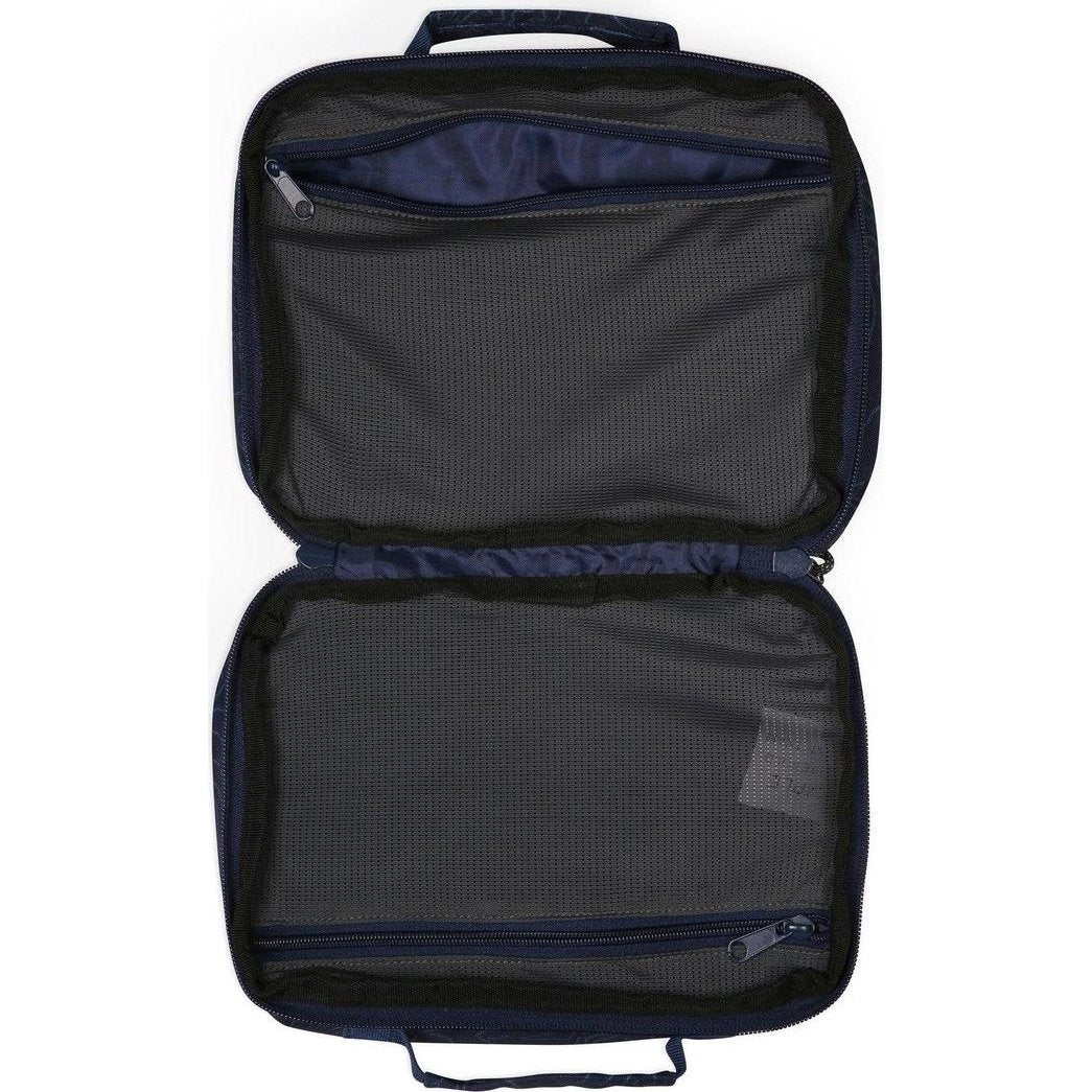The open Kavu Take In Tow travel accessory bag in Ground Cover color shows its mesh interior and zippered compartments against a white background.