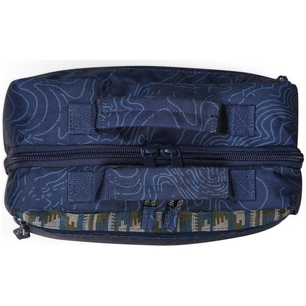Top-down view of the Kavu Take In Tow in Ground Cover showing the top zipper and patterned interior lining.