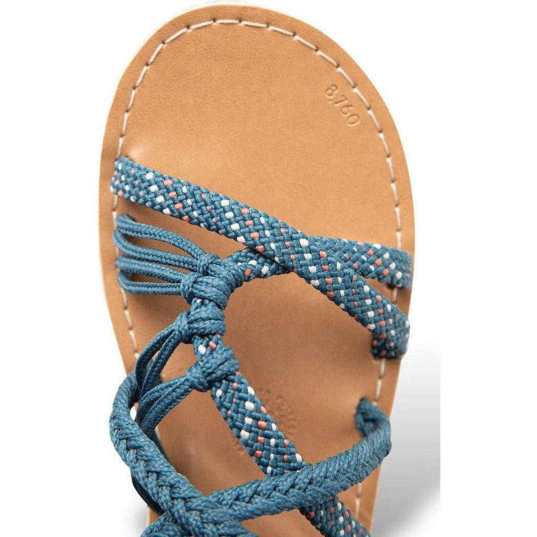 A close-up of the Kavu Women's Alderbrooke sandals in Pavement color, showing the braided straps and tan leather sole against a white background.
