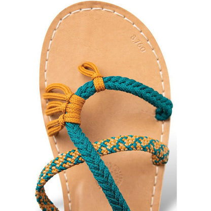A close-up of the Kavu Women's Horizon Canyon sandals showing the braided straps and leather sole against a white background.