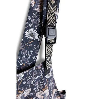 Side view of the Kavu Women's San Blas showing the adjustable buckle and floral pattern against a white background.