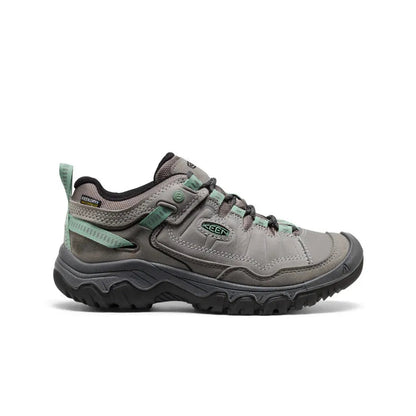 Side view of the Keen Women's Targhee IV Waterproof Hiking Shoe in Alloy/Granite Green with a lugged outsole against a white background.