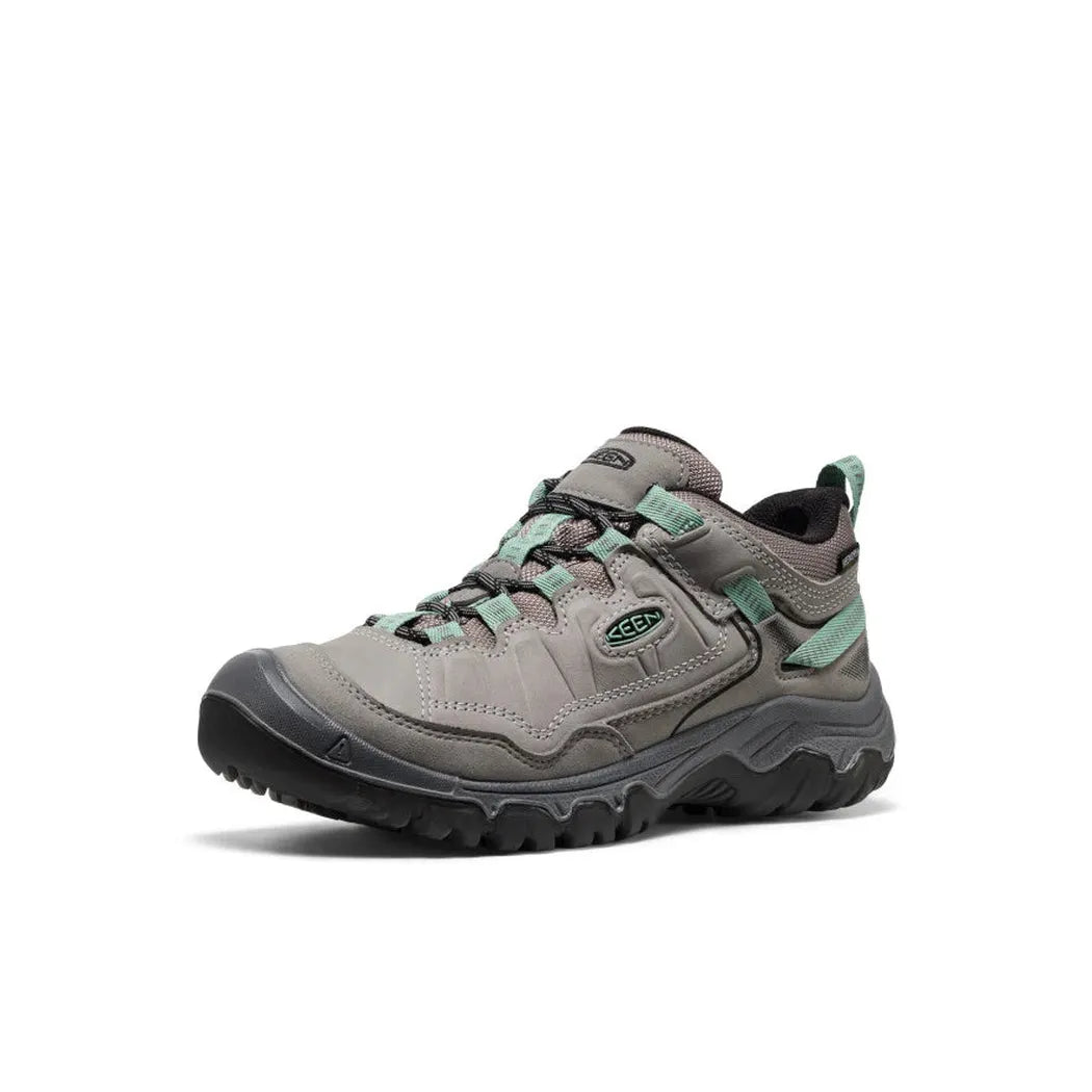 Side view of the Keen Women's Targhee IV Waterproof Hiking Shoe in Alloy/Granite Green with a lugged outsole against a white background.