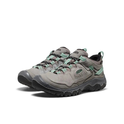 Side view of the Keen Women's Targhee IV Waterproof Hiking Shoe in Alloy/Granite Green with a lugged outsole against a white background.