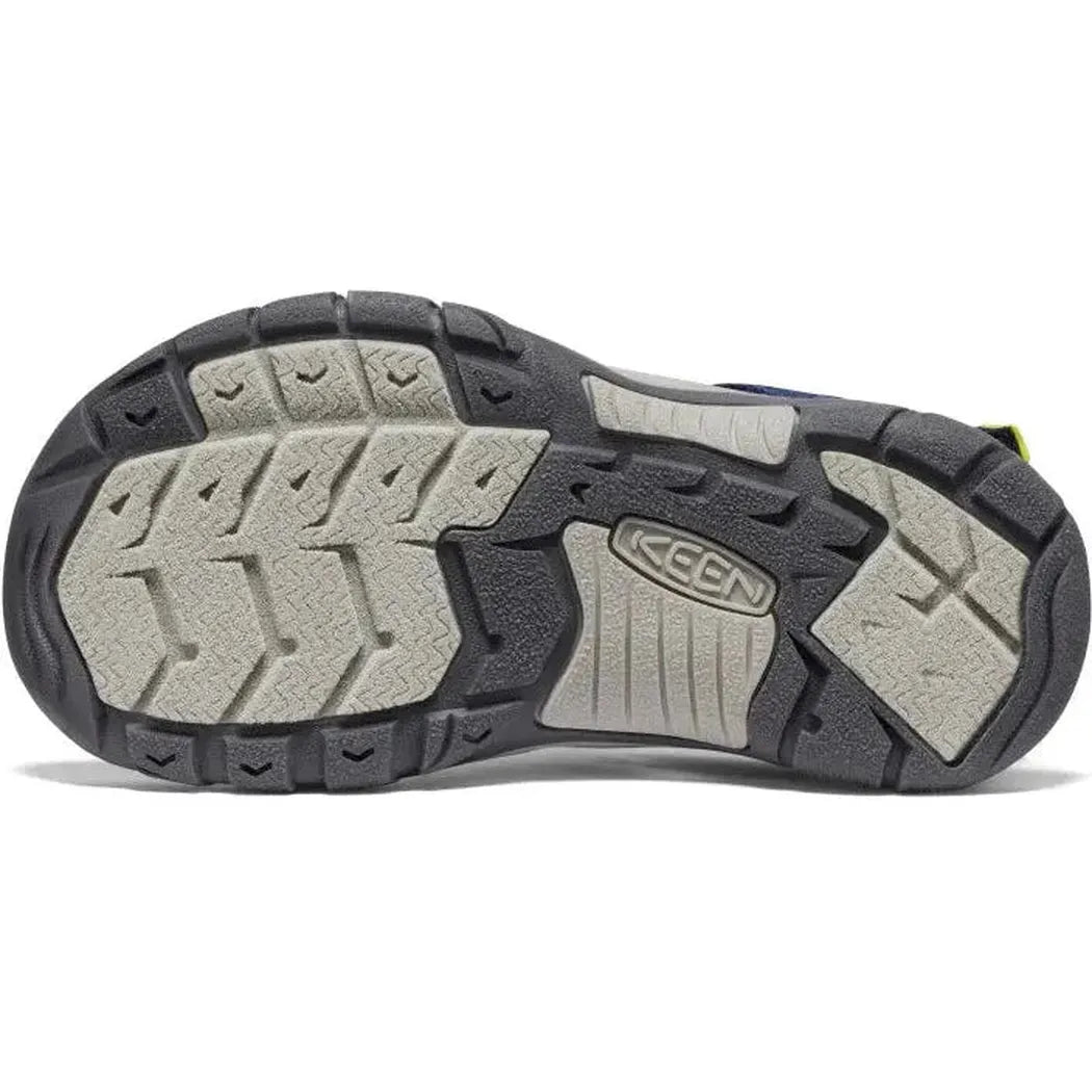 The sole of the Keen Youth's Newport Boundless in Legion Blue/Willowherb is shown from below, highlighting the lugged tread pattern against a white background.