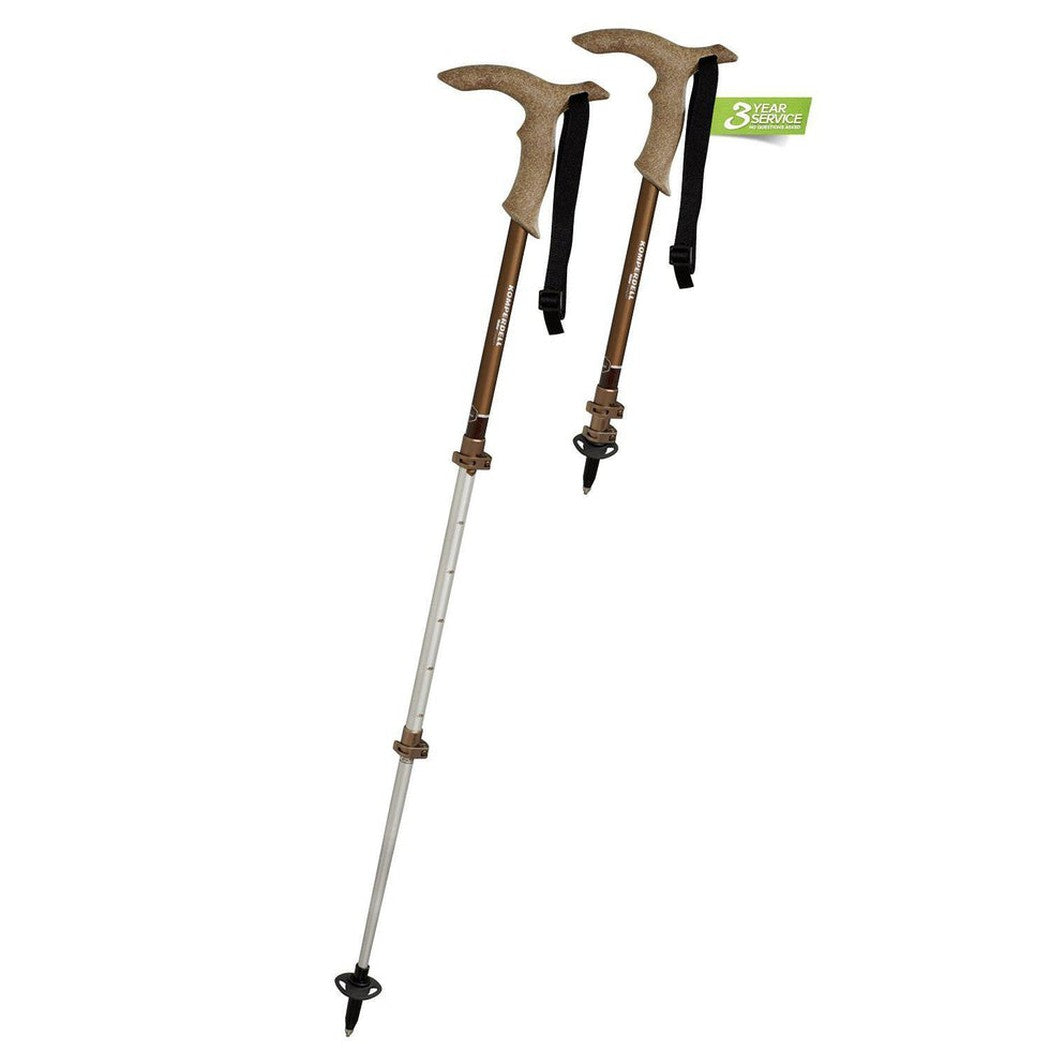 Two Komperdell Walker Powerlock Compact trekking poles with brown handles and silver shafts are shown against a white background.