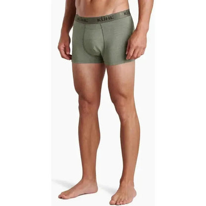 A front view of a man wearing Kuhl Korruptr Boxer Briefs in Blackout color against a white background.