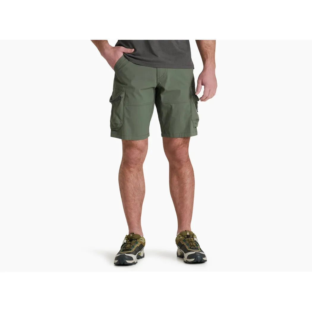 A front view of the Kuhl Men's Ambush Cargo shorts in Ambush Cargo color, showing the cargo pockets and a model wearing them against a white background.