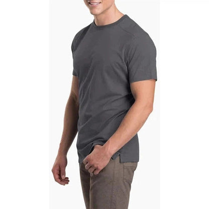 Side view of the Kuhl Men's Bravado Carbon tee on a model against a white background.