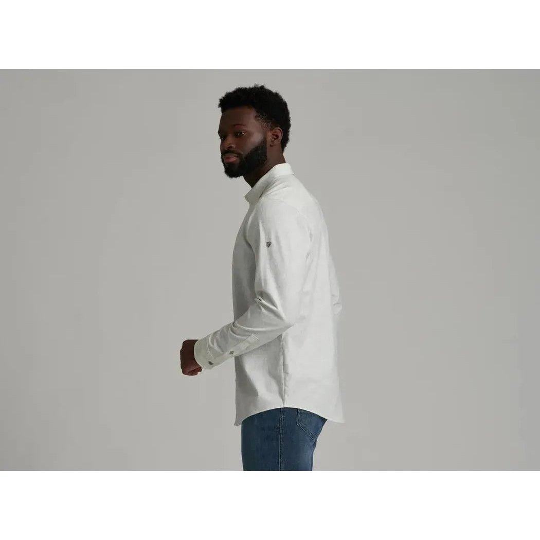 Side view of the Kuhl Men's Breeze Long Sleeve in Bone showing the model wearing it against a light gray background.