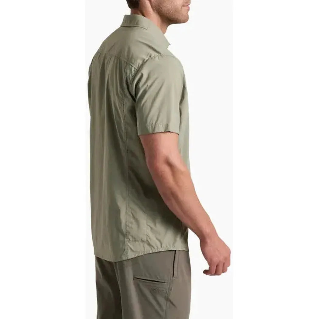 Side view of the Kuhl Men's Driftr Short Sleeve in Spanish Moss showing the short sleeves and cargo pocket against a white background.