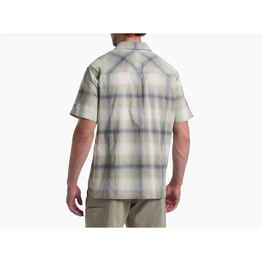 Back view of the Kuhl Men's Konquer Short Sleeve in Feather Grey on a model wearing khaki pants against a white background.