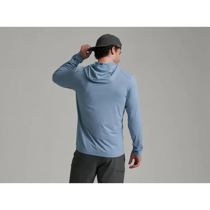 Back view of the Kuhl Men's Kovert Hoody in Mineral Blue on a model against a gray background.