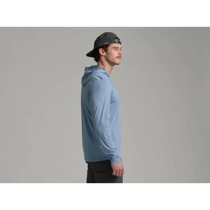 Side view of the Kuhl Men's Kovert Hoody in Mineral Blue on a model against a gray background.