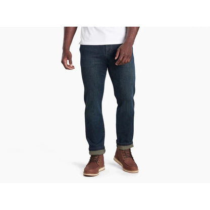 A front view of a model wearing Kuhl Men's Kuhl Denim in Midnight against a white background.