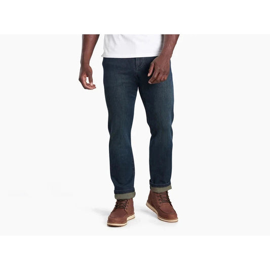 A front view of a model wearing Kuhl Men's Kuhl Denim in Midnight against a white background.