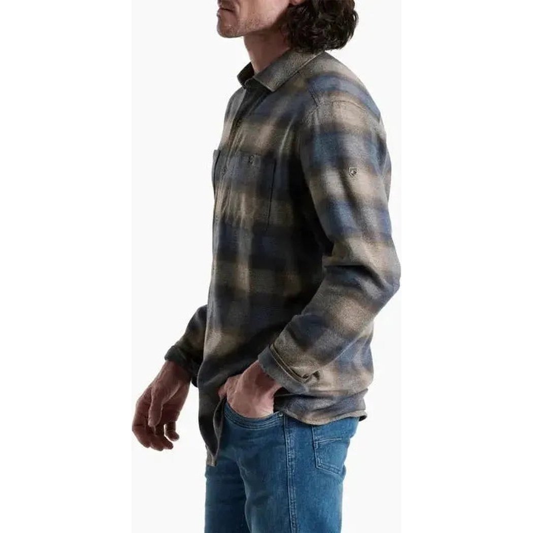 Side view of the Kuhl Men's Law Flannel Long Sleeve in Fog Harbor showing the model wearing it against a white background.