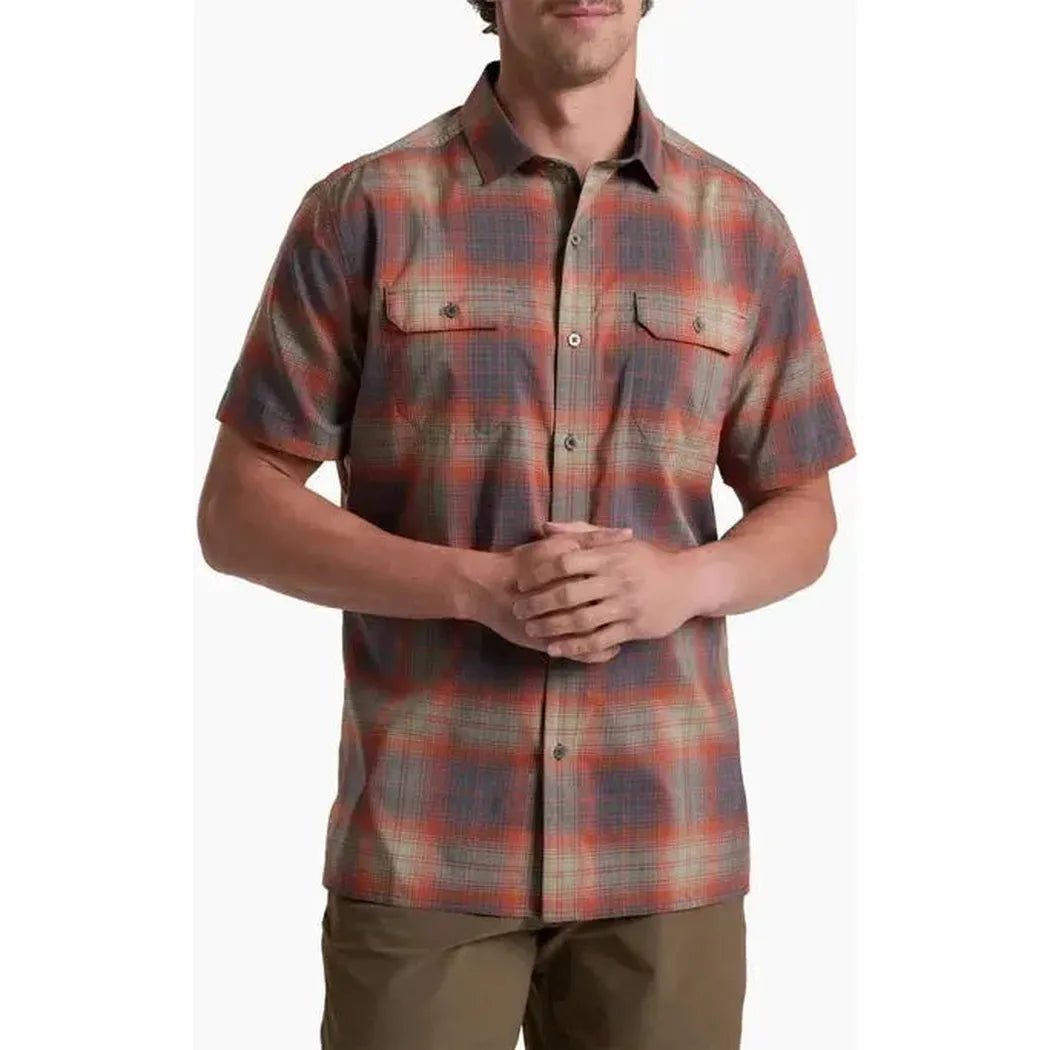 A front view of the Kuhl Men's Response short - sleeve shirt in Ember Red, showing chest pockets and a model wearing it against a plain background.