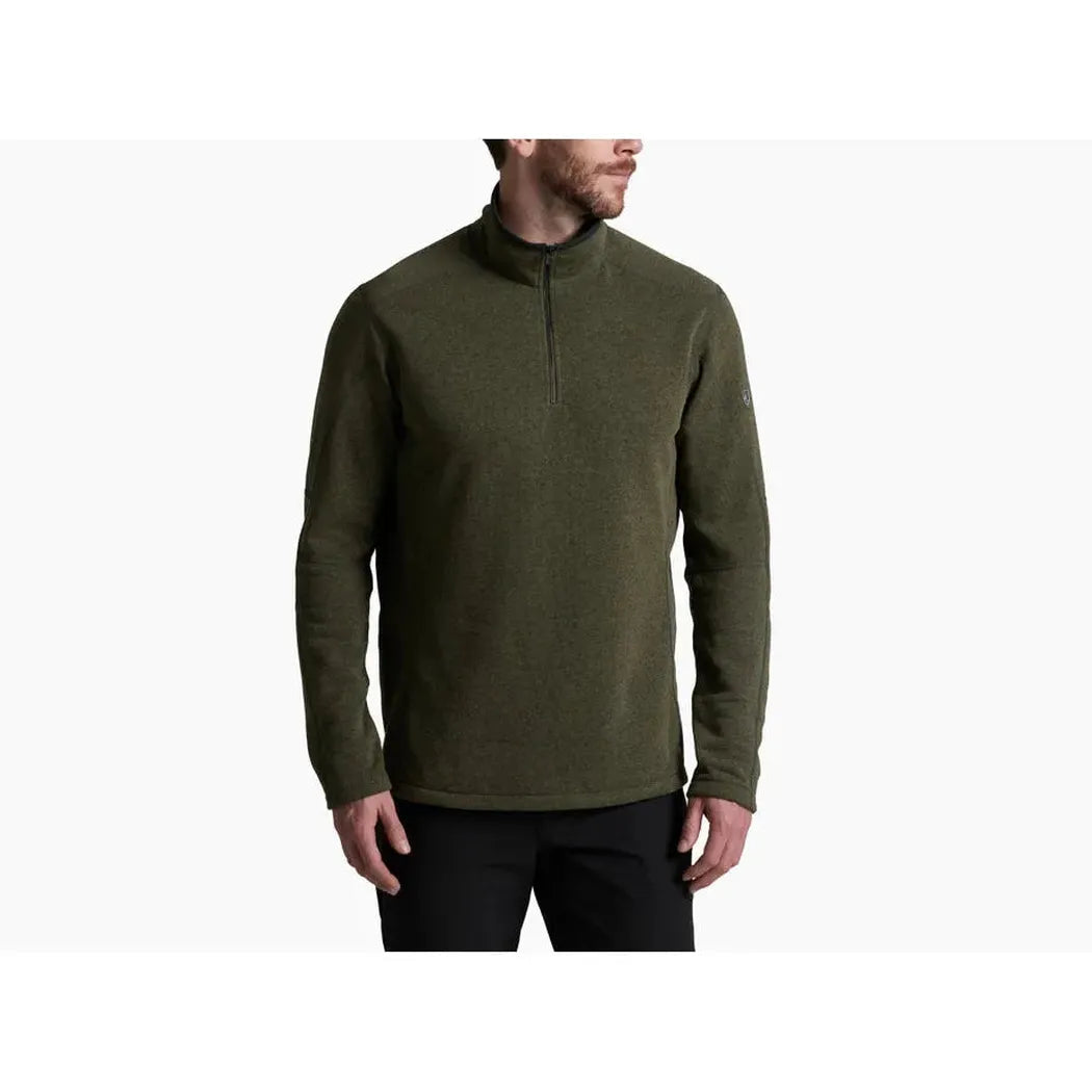 A front view of the Kuhl Men's Revel™ 1/4 Zip Sweater in Black/Steel on a model against a white background.