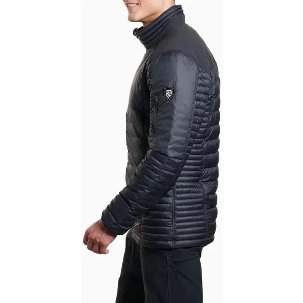 Side view of the Kuhl Men's Spyfire Jacket in Blackout showing the quilted design and model wearing it against a white background.