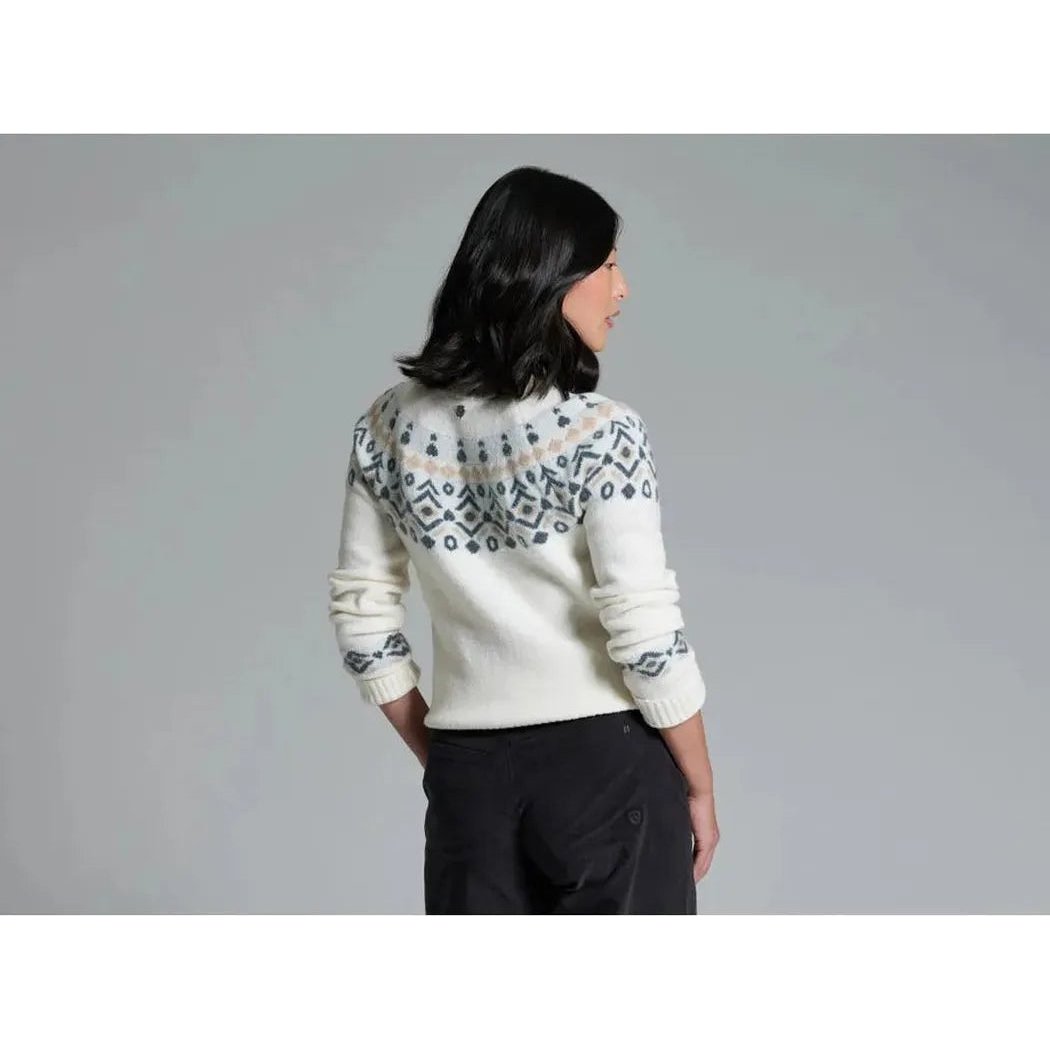 Back view of the Kuhl Women's Alpina Sweater in Alpine White on a model against a gray background.
