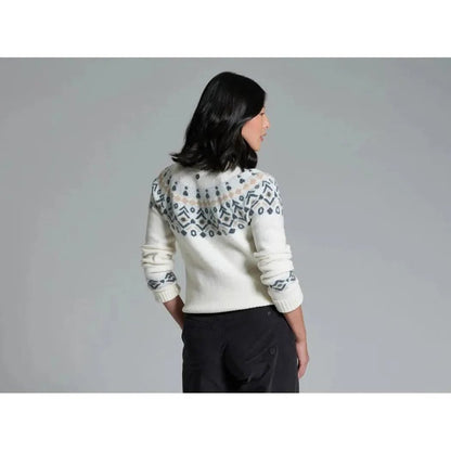 Back view of the Kuhl Women's Alpina Sweater in Alpine White on a model against a gray background.