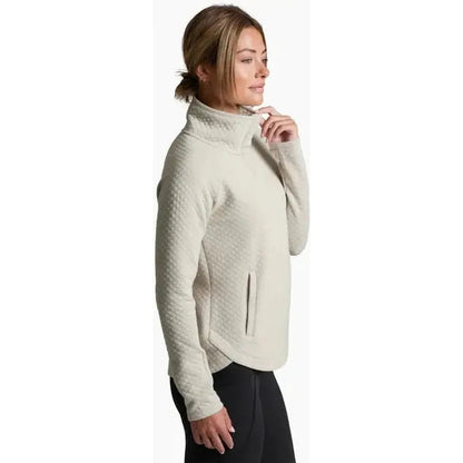 Side view of the Kuhl Women's Argenta Pullover in Moon Light showing the high collar and zippered pocket against a white background.