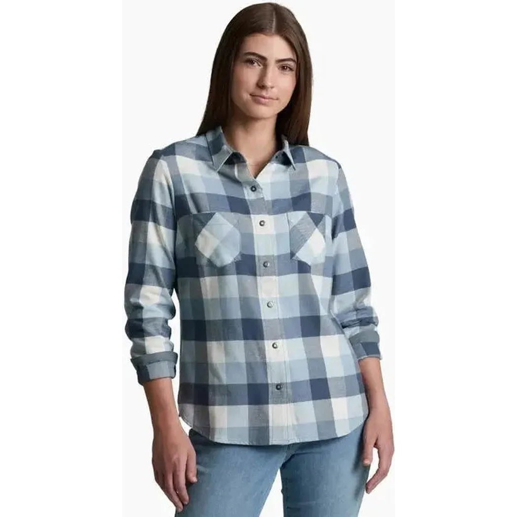 A front view of the Kuhl Women's Darcy Flannel in Cherrywood on a model wearing light blue jeans against a white background.