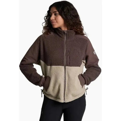 Side view of the Kuhl Women's Elixir Coffee jacket showing the front pockets and zipper against a white background.