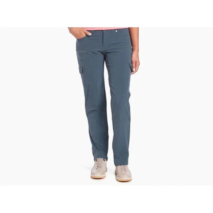 A front view of the Kuhl Women's Freeflex Roll-Up Pant in Fallow, showing cargo pockets and a model wearing light-colored shoes against a plain white background.